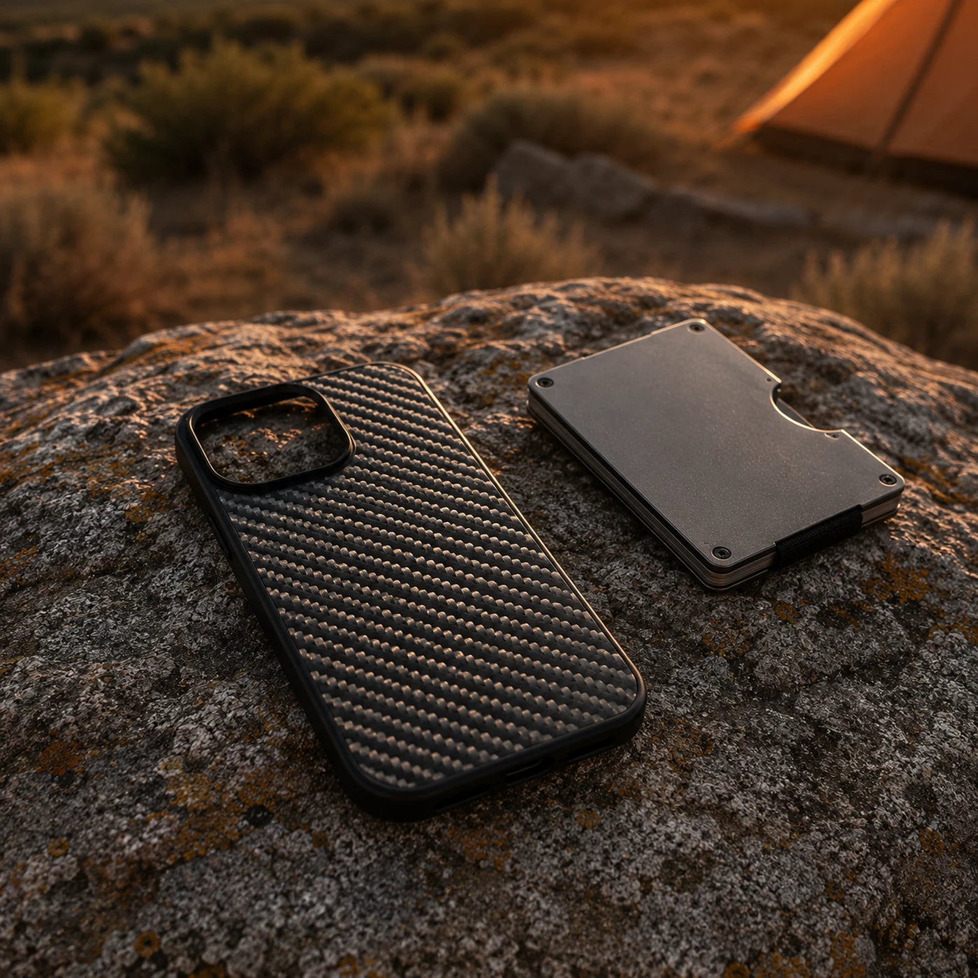 Vanefield CarbonArmor Case and a cardholder on a rock at golden hour
