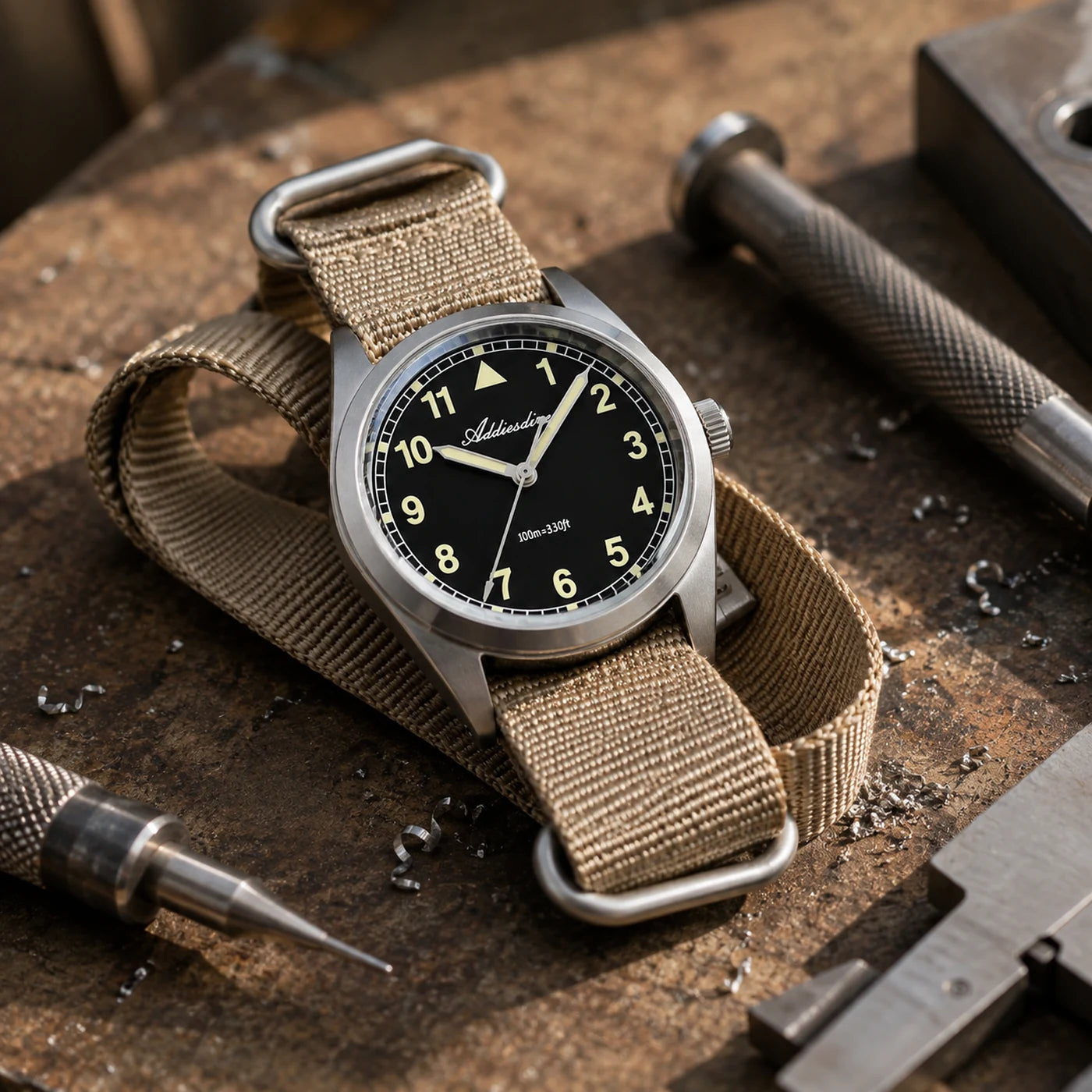 Vanefield Field Watch 38 on a workbench with tools