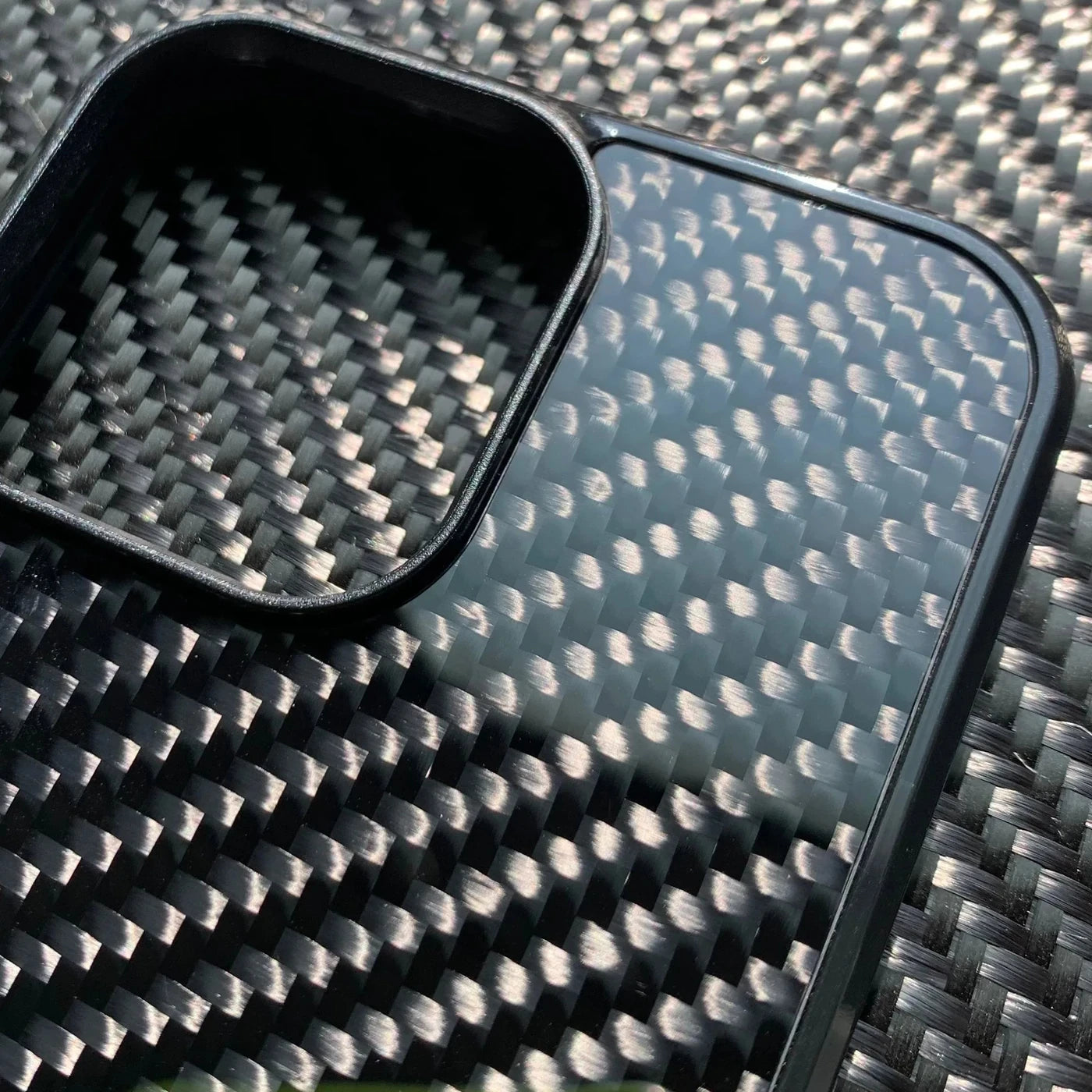 Close-up of the camera bezel and twill weave of the Vanefield CarbonArmor Case