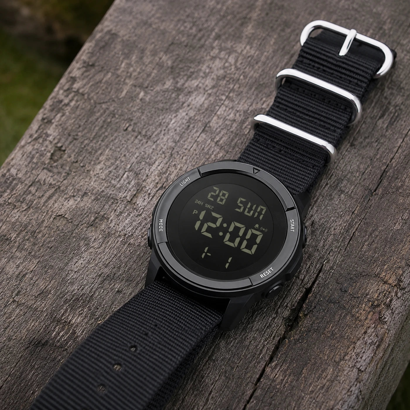 Vanefield Watch 45 fitted with the black nylon strap, on weathered wood